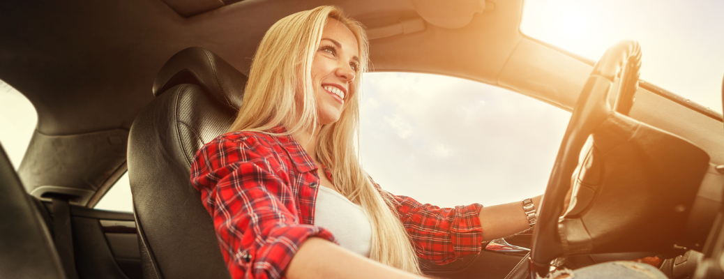 A woman driving a vehicle