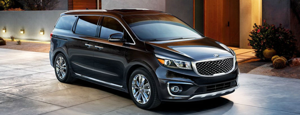 2018 Kia Sedona in front of a building