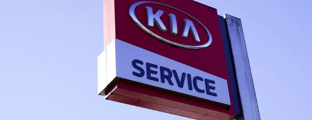 a board with Kia Service written on it