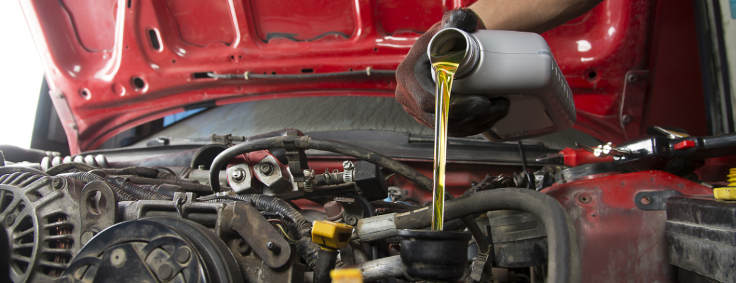Mechanic changing a vehicle's oil