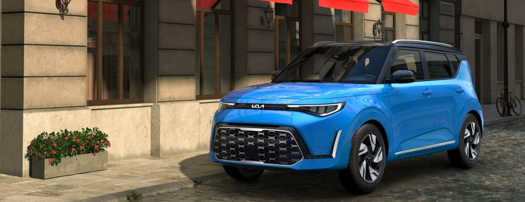 Side view of the 2025 Kia Soul parked in front of a building