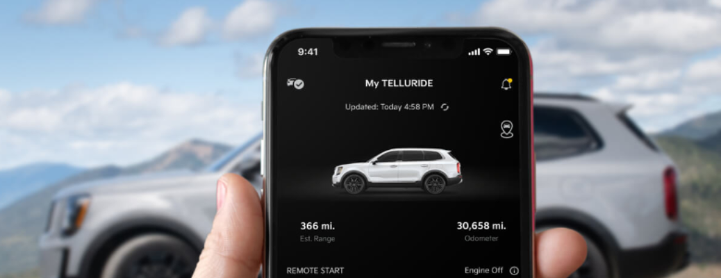 A man checking vehicle status on the Kia Connect App