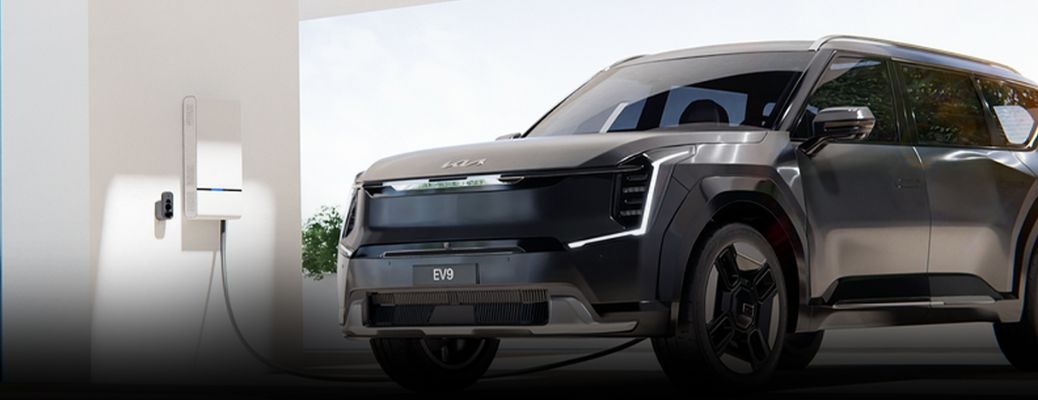 Kia EV9 plugged at a home parking