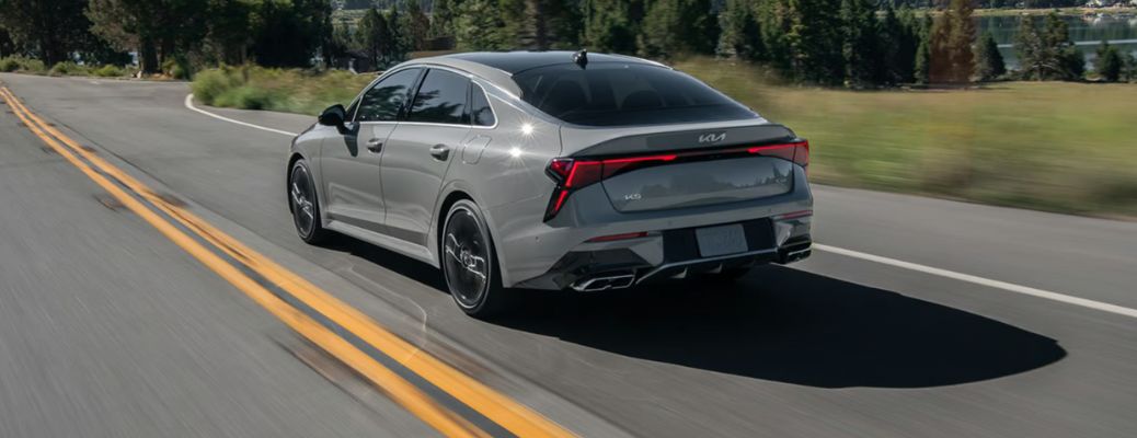 rear view of the 2025 Kia K5 on the road
