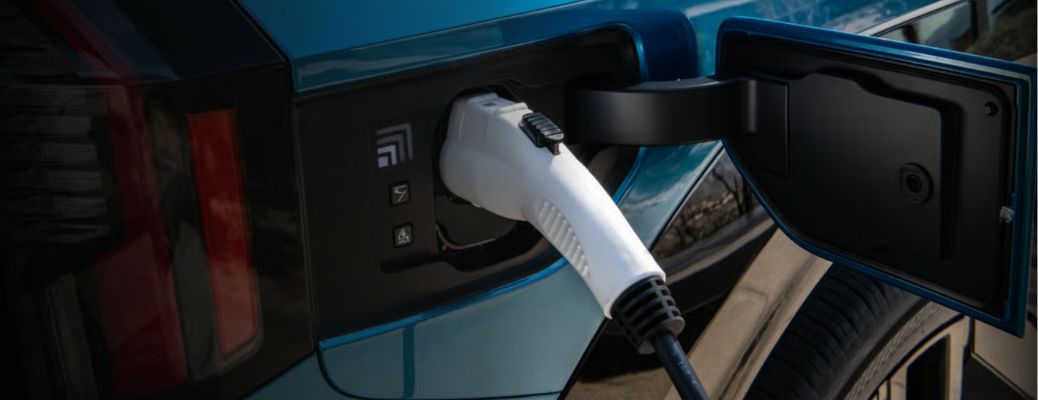 close up of a Kia EV getting charged