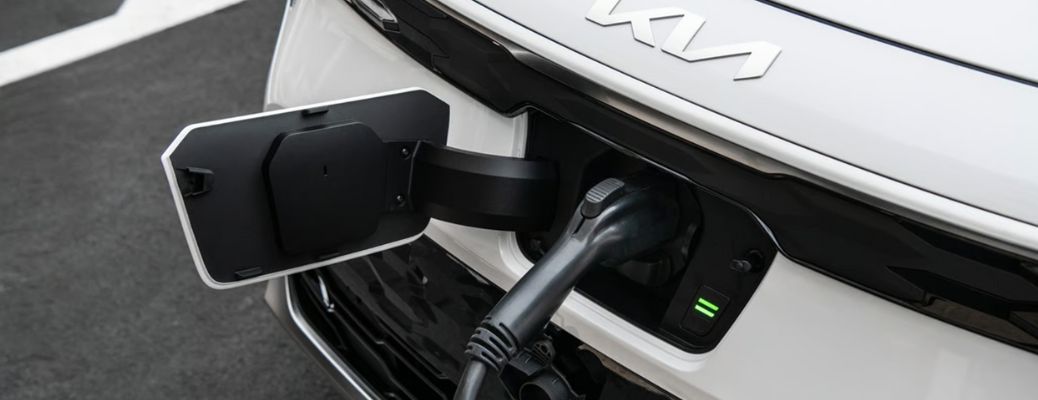 close up of a Kia EV getting charged