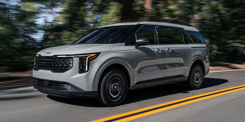 A 2026 Kia Carnival Hybrid making its way down the road in Akron, OH