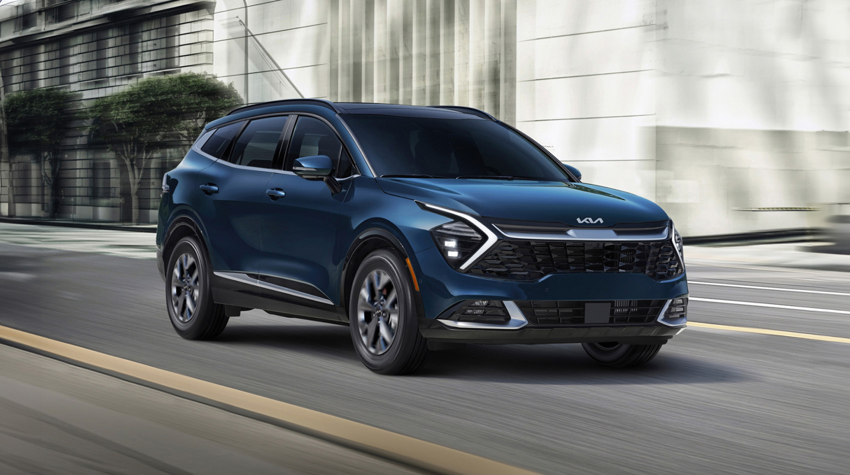 Blue Kia driving on road
