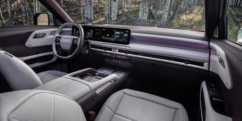 2027 Kia Telluride front cabin with touchscreen infotainment, digital displays, steering wheel, and passenger space in Akron, OH
